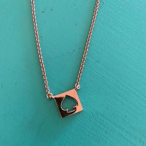 Rose gold Kate Spade necklace.